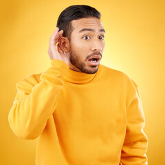 Asian man, listening and gossip with hand on ear in studio background for information. Shock,...