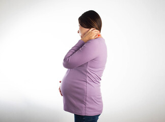 Neck pain in a pregnant girl in a purple blouse on a white background. The concept of...