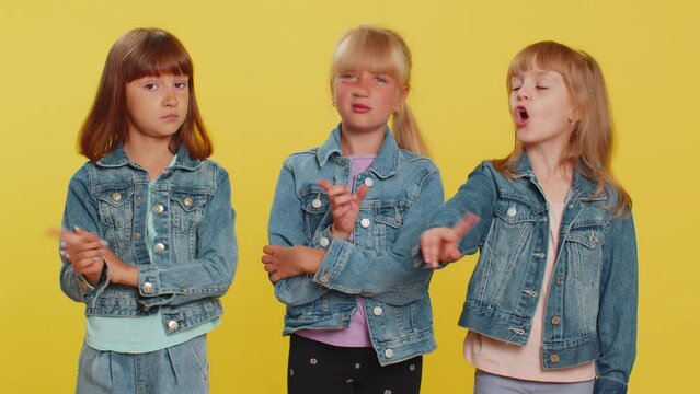 Displeased upset teenage girls reacting to unpleasant awful idea, dissatisfied with bad quality, wave hand, shake head No, dismiss idea dont like proposal. Little children sisters. Three siblings kids