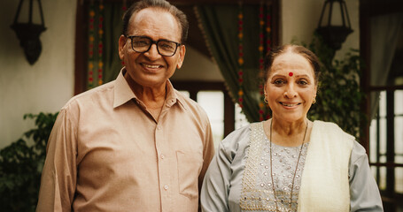 Portrait of Happy Indian Elderly Couple Posing Together at Their Authentic Mumbai Home. Senior...