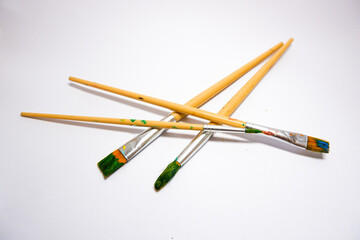 Used paint brushes isolated on a white background.