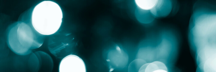 Blurred lights, dark blue background, banner texture. Abstract bokeh with soft light header. Wide screen wallpaper. Panoramic web banner with copy space for design