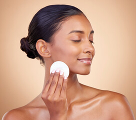 Woman, face and cotton pad, beauty and makeup removal, clean and natural skincare isolate on studio...