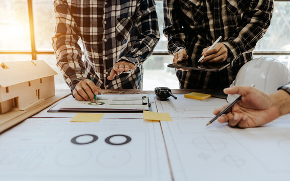 Civil engineer team meeting Modern construction planning meeting, foreman, industrial project manager, engineering team, professional team in Asian industry