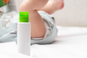 Moisturizing oil with vitamin for the care of dry baby skin. Copy space for text