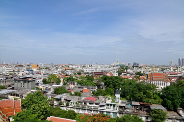 Fototapeta na wymiar BANGKOK, THAILAND - July 22, 2023 : Landscape View of Bangkok City and Thai Buddhist Temple with Blue sky with white cloud. Clear day and good weather in the morning.