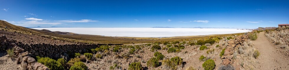 Fototapeta na wymiar Panorama of the famous Salar de Uyuni, the biggest salt flats in the world, viewed from a mountain on the edge of the lake - natural sight in Bolivia