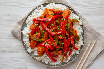 Homemade Simple Chili Chicken with White Rice on a Plate, top view. Flat lay, overhead, from above.