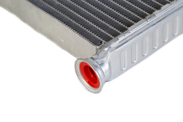 Aluminum radiator of a car stove on a white background, close-up, isolated