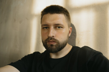 Handsome guy, selfie portrait in the setting sunlight