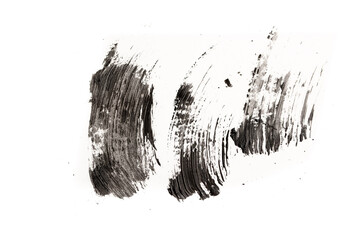 Black mascara brush strokes isolated on white.