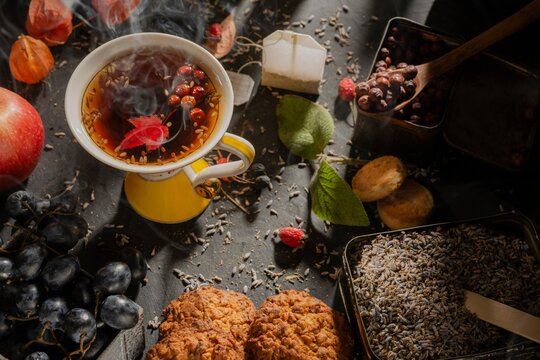 Dark food: herbal tea in a cup. Clipart photo