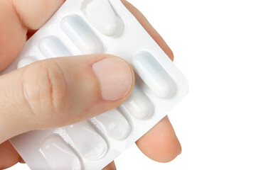 Take the pill out of the blister. Isolate on a white background.