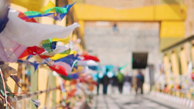 Closeup shot of buddhist prayer flags waving at Chicham Bridge in Spiti valley at Himachal Pradesh, India. Prayer flags tied at the side of the bridge waves in the strong winds of the valley. 