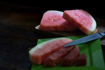 Fresh and Juicy Watermelon in Slices and Cubes on Black
