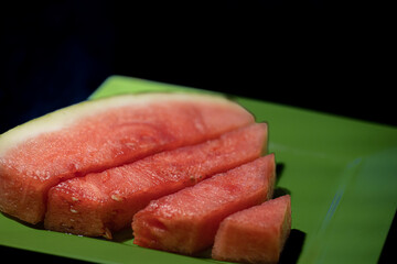 Fresh and Juicy Watermelon in Slices and Cubes on Black