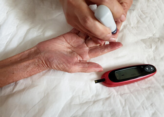 One of step of checking blood sugar, use the lancing device to puncture of your fingertip with the...