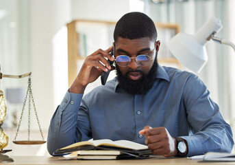Phone call, reading and notebook with a black man lawyer reading information for a legal case or...