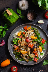 Warm eggplant, pepper, tomato and basil salad