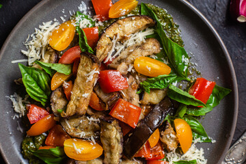 Warm eggplant, pepper, tomato and basil salad