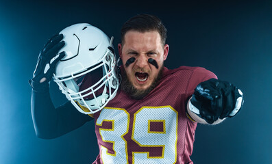 American football player on stadium in action. Template for a sports magazine on the theme of...