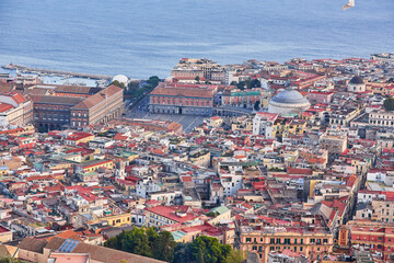 Naples, Italy evening panorama of city center coastal section with Plebiscito square and Palazzo Real