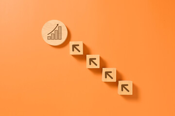 Graph and arrow up icon on wooden blocks, Business growth success process, Business achievement...