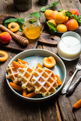 Cottage cheese wafers with apricots and honey in a bowl