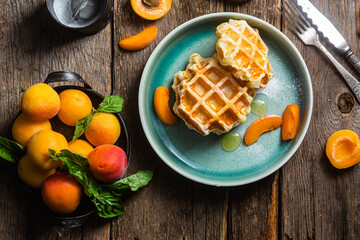 Cottage cheese wafers with apricots and honey in a bowl