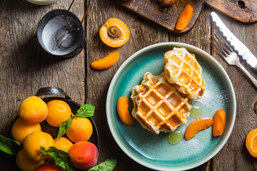 Cottage cheese wafers with apricots and honey in a bowl