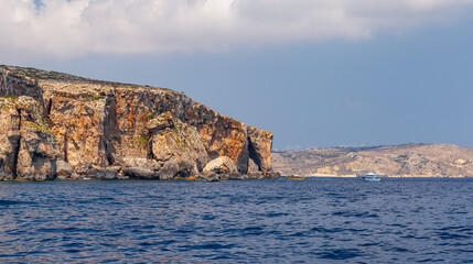 Natural stone arch of Comino island, Malta. Summer landscape