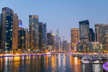 Fototapeta na wymiar Dubai Marina bay with residential neighborhood at night