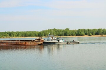 Fototapeta na wymiar Barge for transportation of bulk cargo on the Kama River