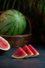 Fresh sliced watermelon with full watermelon on the background
