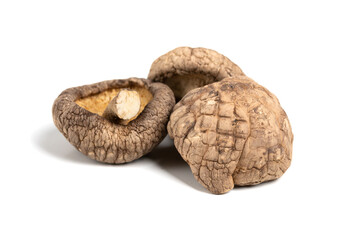Dry shiitake mushrooms on a white isolated background. Asian cuisine, ingredient for miso soup