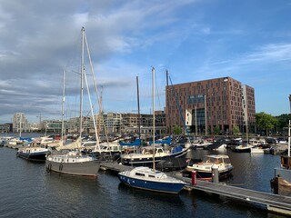 Fototapeta na wymiar Boats parking in port of Amsterdam, NL
