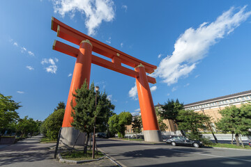 Large torii gate of Heian Jingu shinto religious shrine seen in Kyoto Japan on a luxury holiday as a tourist 