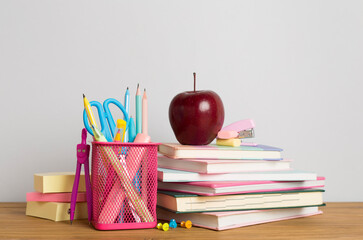 Composition with books and stationery on wooden table. Back to school concept