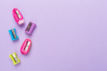 Different sharpeners on color backgroung, top view