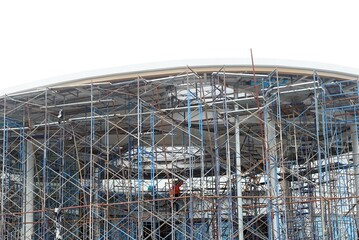 Scaffolding and building construction site isolated on white background with clipping path