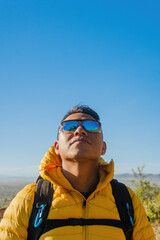 Young Adventurer Capturing Happiness on the Mountain Peak