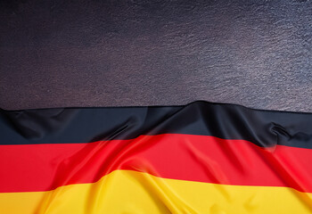 germany flag on dark table background with copy space