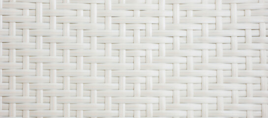 White chair with basket weave pattern