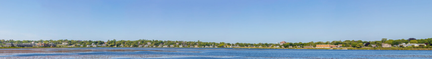 Fototapeta na wymiar Panoramic view of the seashore and residential area from Fort Adams State Park in Newport, Rhode Island