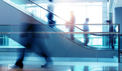 Business people rushing in the lobby