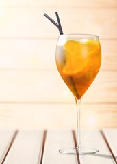 Tasty alcohol cocktail in glass on the desk