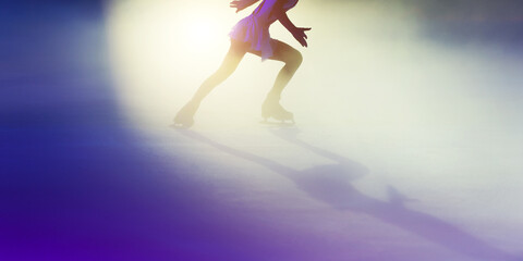 Young girl ice figure skating with beautiful light effect