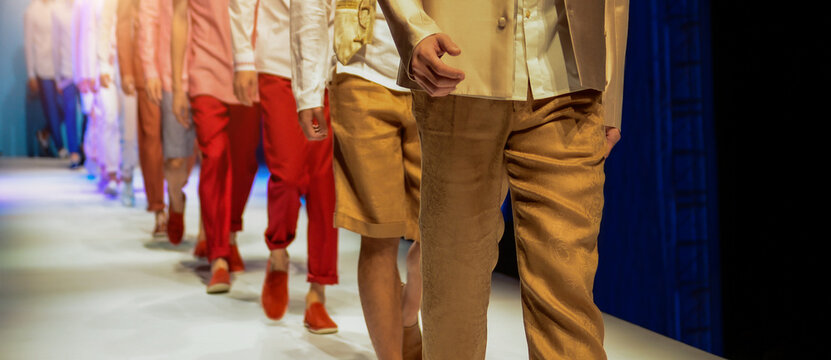 Fashion show with male models on the stage