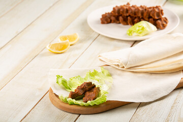 Raw meatballs or raw meatballs on a white wooden background. To close. local Turkish style raw meatballs
