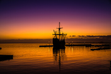 Spanish Galleon docked at the pier before sunrise - Powered by Adobe